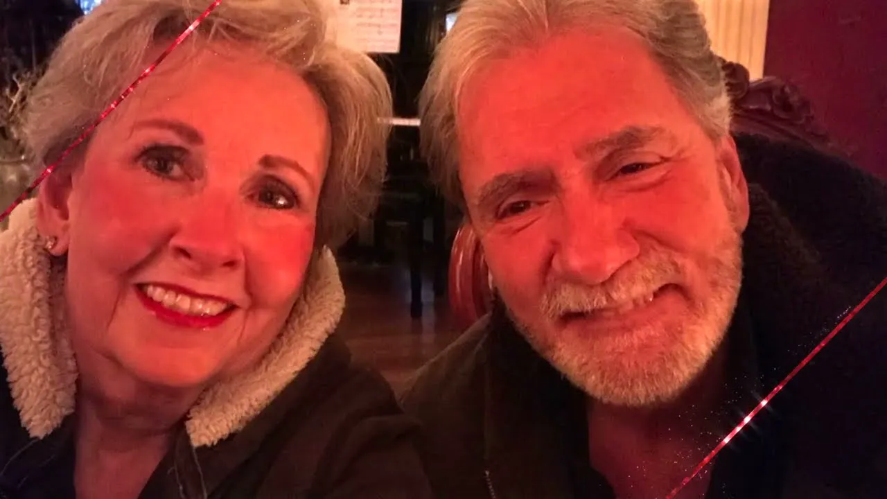 A couple smiling together in an anniversary film
